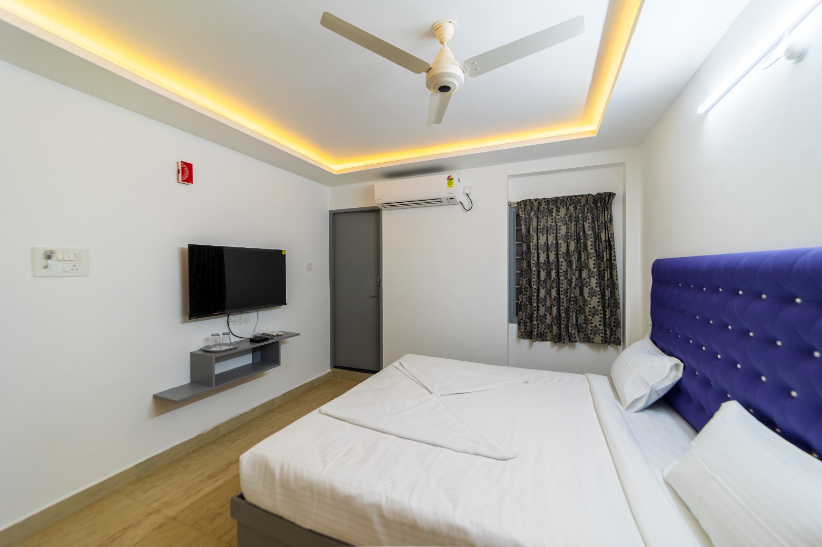 Deluxe Room rain-shower bathroom with premium amenities