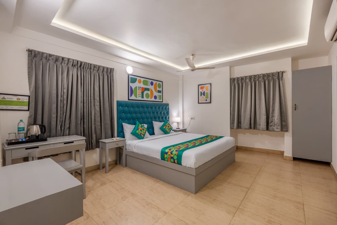 Deluxe Maple Room – Spacious Room with Teal Tufted Headboard | Bonne Chance Heritage Residence, Puducherry